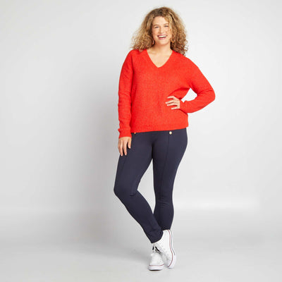 بنطلون ضيق بأزرار ذهبية اللون أزرق