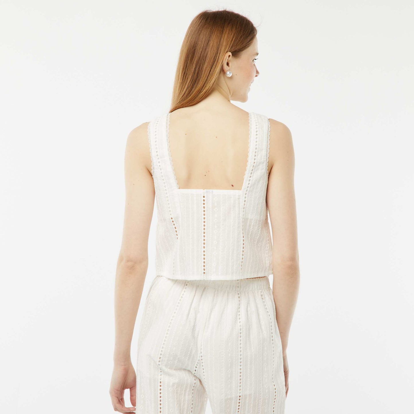 A lightweight sleeveless blouse with tie fastening and broderie anglaise WHITE