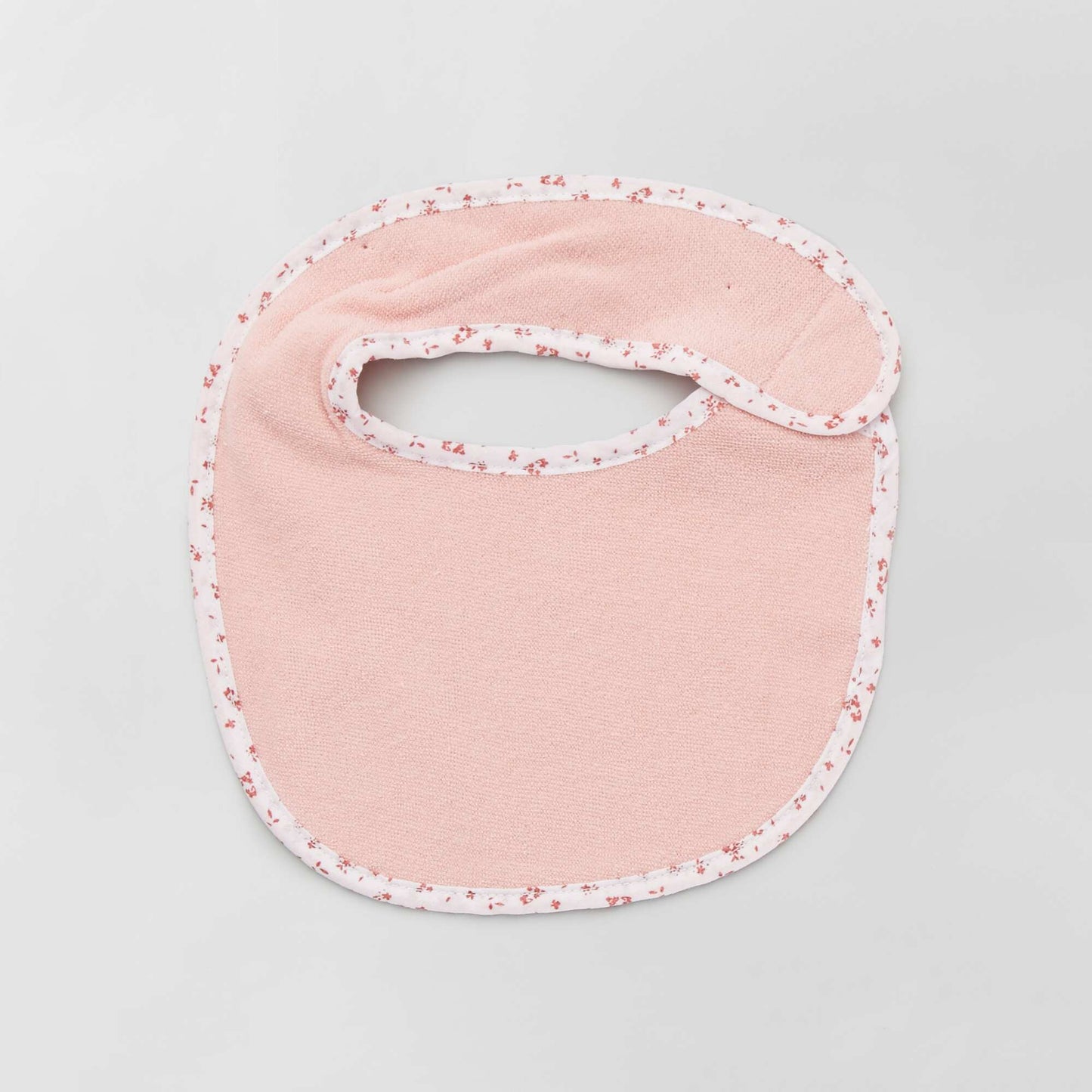 Pack of 7 towelling bibs with hook and loop fastening PINK